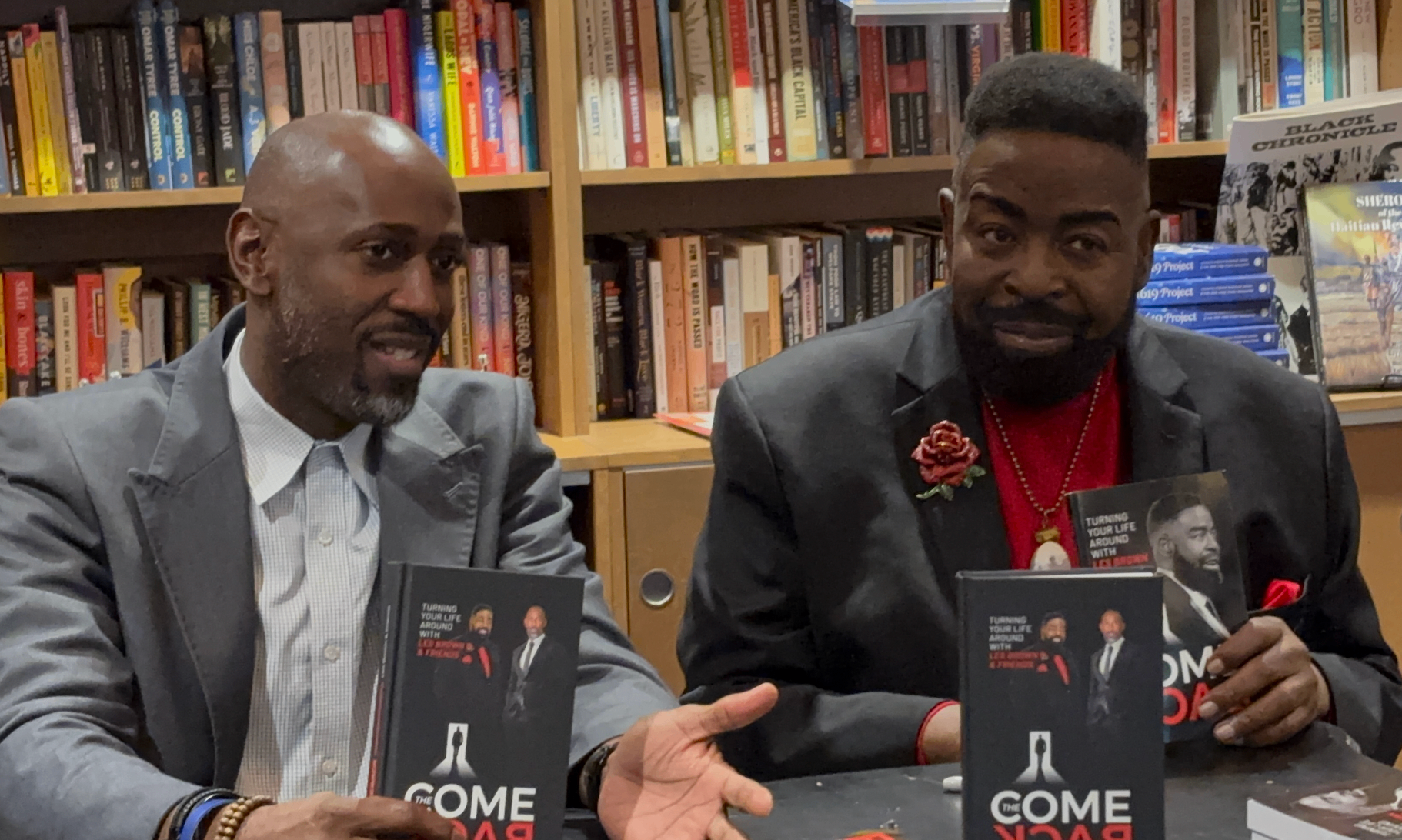 Les Brown and Dr. Dwight Shawrod Riddick, II at a book signing for their co-authored book