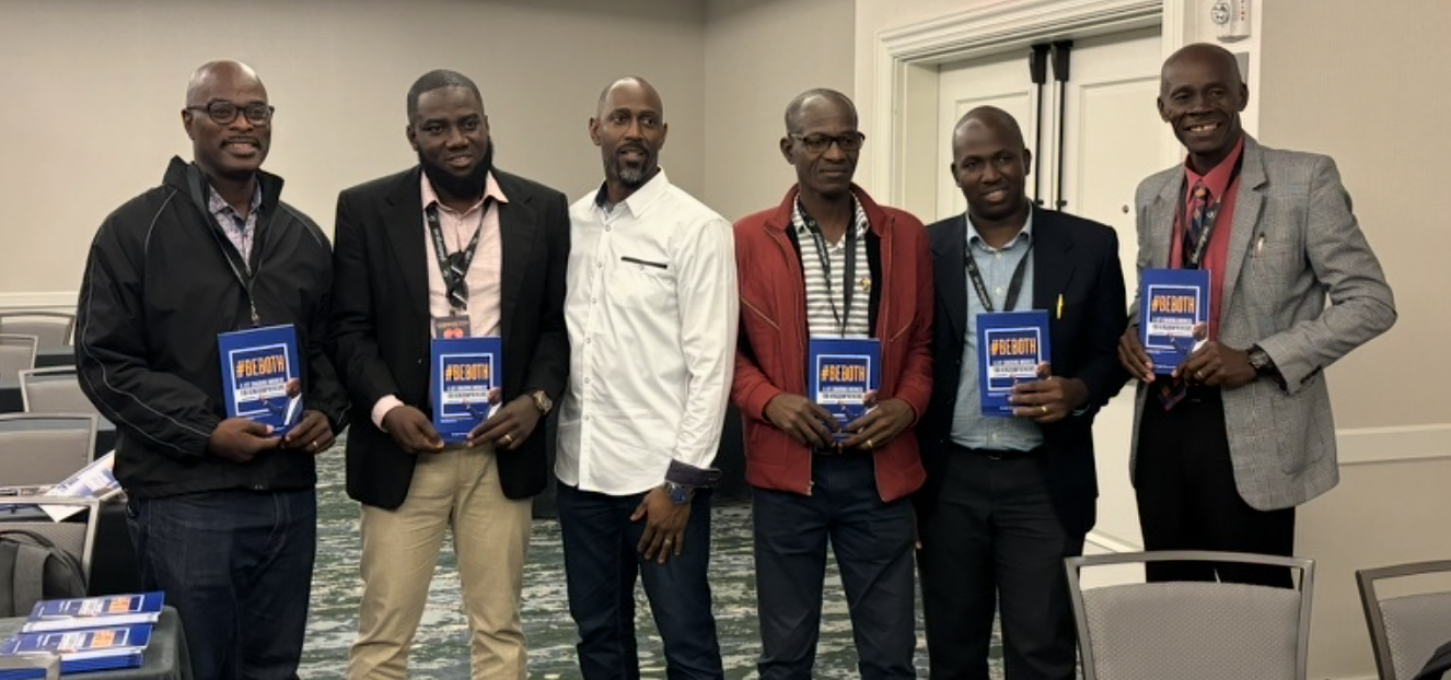 Group of authors proudly holding their co-authored books together
