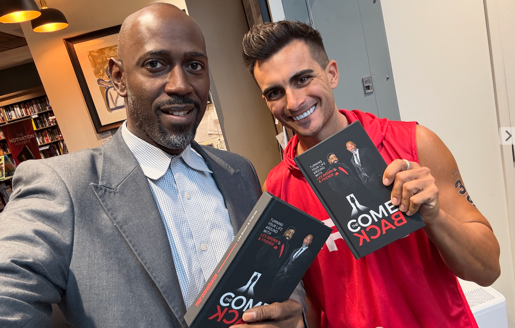 Dr. Riddick with a fellow author holding published The Comeback books