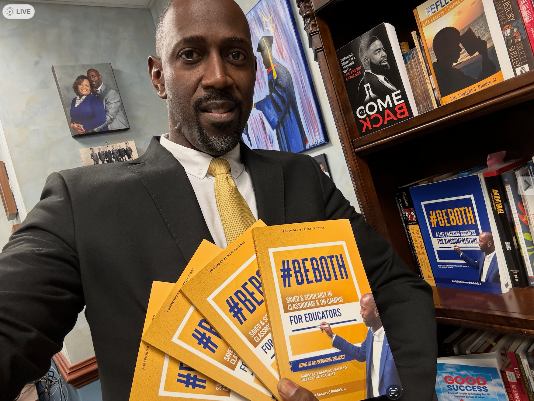Dr. Riddick holding published #BEBOTH books — your finished anthology could look like this